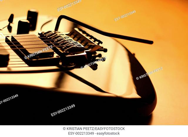Details of a black electric guitar with copy-space