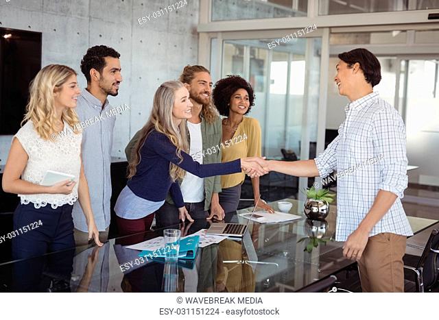 Business people shaking hand at creative office