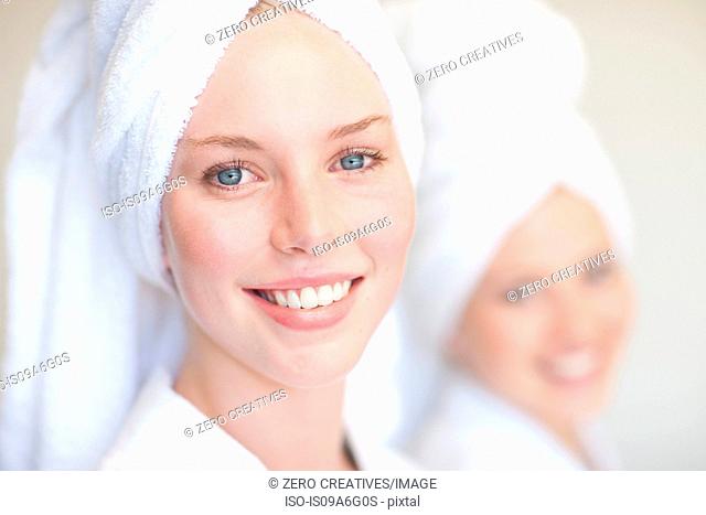 Young women with towels on heads in spa
