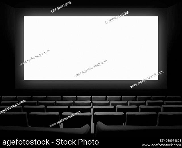 Cinema movie theatre with velvet seats and a blank white screen. Copy space background