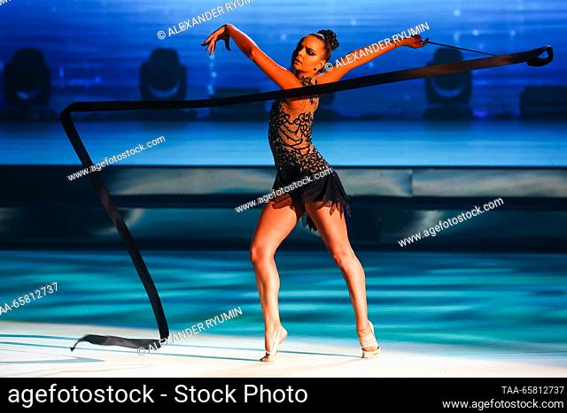 RUSSIA, NIZHNY NOVGOROD - DECEMBER 16, 2023: Rhythmic gymnast Dina Averina performs during the Swan Lake gymnastics show at the Nagorny cultural and...