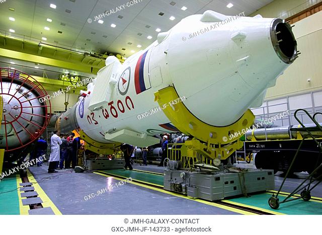 The Soyuz MS-02 spacecraft, encapsulated in its fairing, is seen undergoing final checks during final assembly of the Soyuz rocket on Friday, Oct