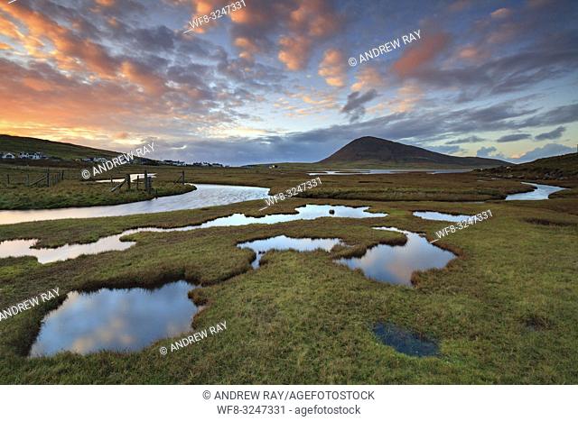 Sunset captured from Northton Salt Marsh on the Isle of Harris in early November. A long shutter speed was utilised to flatten the ripples on the surface of the...