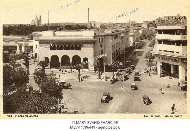 Aerial view of crossroads and post office, Casablanca, Morocco, with a car showroom on the right