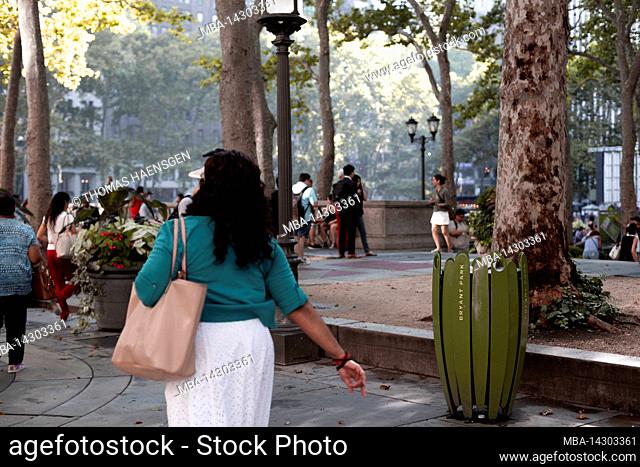 Bryant Park, New York City, NY, USA, people enjoy the evening at Bryant Park - a 9.603-acre privately managed public park located in midtown New York
