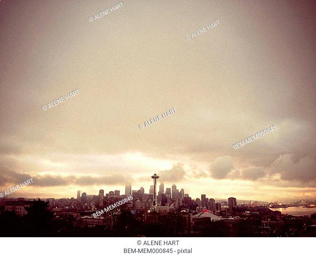 City skyline against cloudy sky, Seattle, Washington, United States