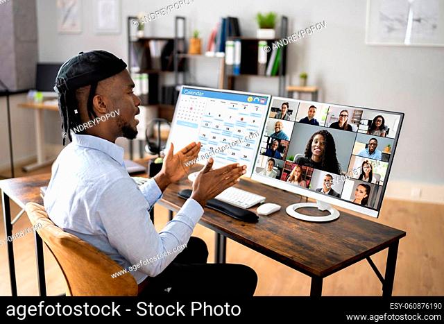 African Man Remote Telecommuting On PC Computer