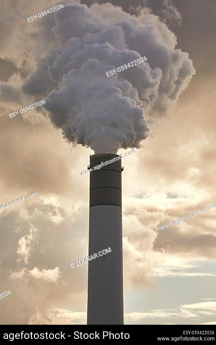 Smoking power plant chimney closeup