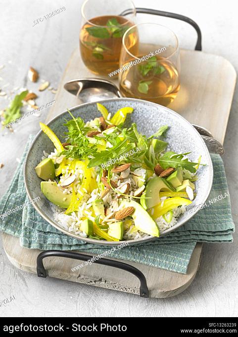 Rice salad with avocado, almonds and rocket