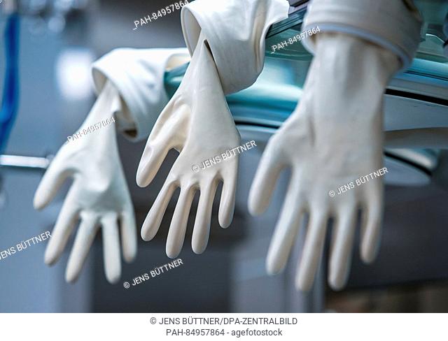 Special gloves can be seen at the new factory of the Hamburg based AqVida GmbH in Dassow, Germany, 21 October 2016. The company specialises on cancer treatments...