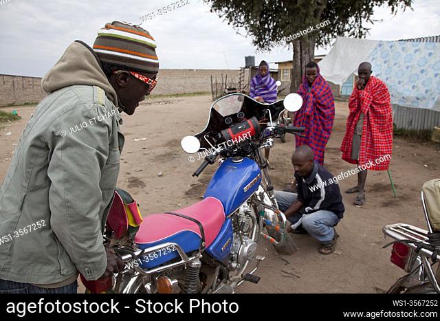 Boda-Boda motorbike taxi run by Masai men in the village of Oliolomutia , next to the Masai Mara Nature Reserve, Kenya