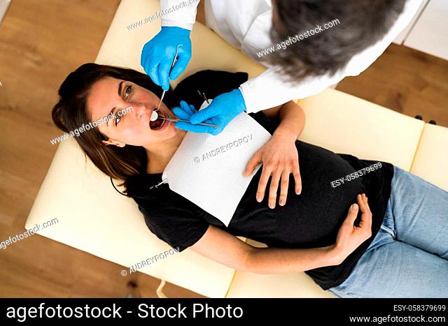 Pregnant Woman Tooth Decay. Dentistry Check By Dentist