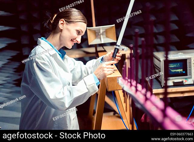 Engineer in high frequency electronics lab performing rf compliance test