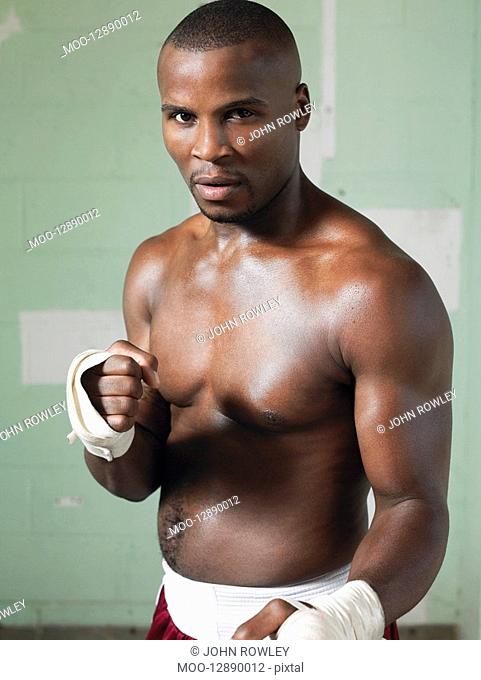 Boxer with raised fists portrait