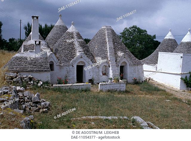 Trulli (traditional dry stone huts with a conical roof) in a village of the Murge Plateau, Apulia, Italy
