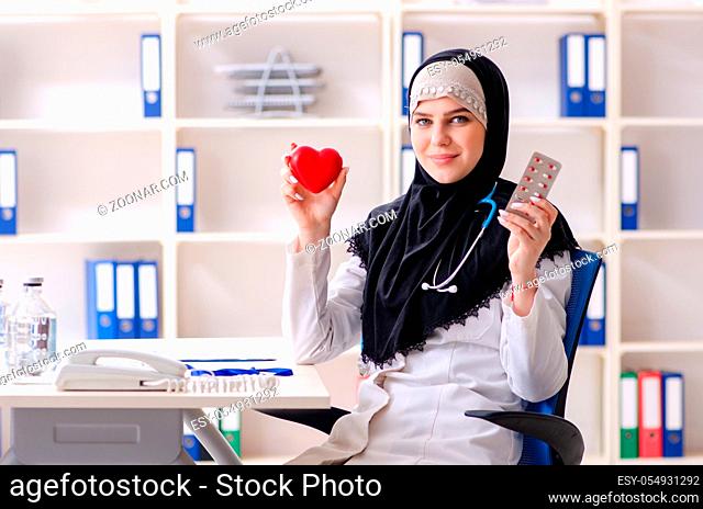 Young doctor in hijab working in the clinic
