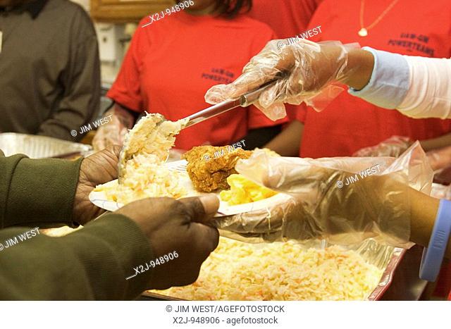 Detroit, Michigan - Students from Pershing High School volunteer to serve lunch at Cass Community Center to developmentally disabled adults  The volunteers were...