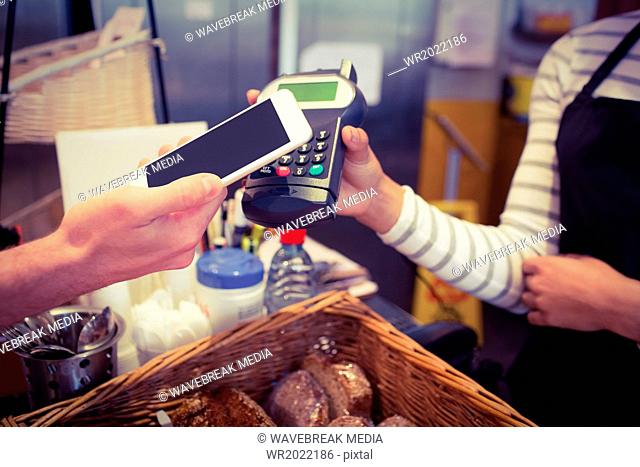 Customer paying with mobile phone