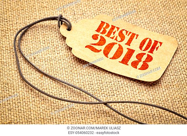 Best of 2018 sign - a paper price tag with a twine iagainst burlap canvas