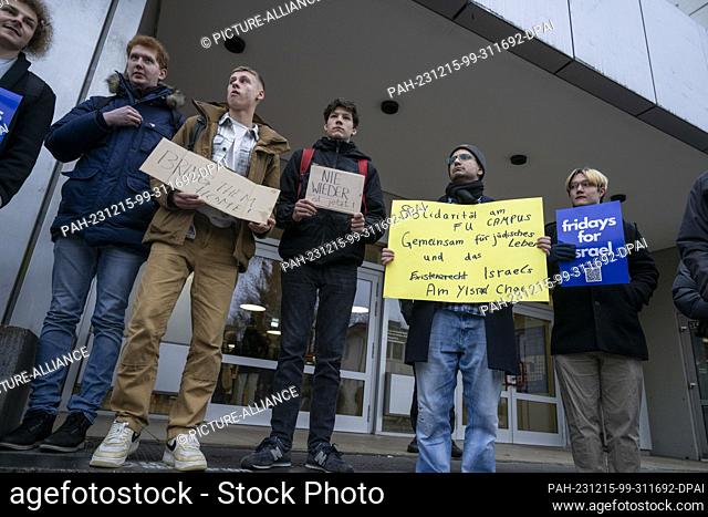 15 December 2023, Berlin: Participants in a Fridays for Israel demonstration stand in front of the entrance to the cafeteria of Freie Universität Berlin