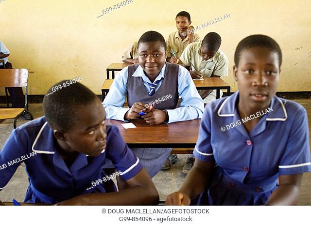 Students lsiten to a guest lecturer at the Nyachuru High School AIDS Club in Zimbabwe The children, 15 to 17 years old, are interested and open to the guest''s...