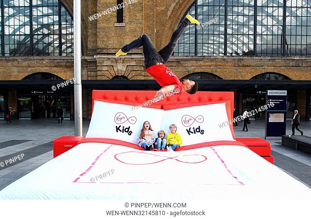 FREE FOR EDITORIAL USE Morning commuters were treated to a surprise today in London, seeing kids of all ages jumped for joy on Virgin TV”s giant 15 square metre...