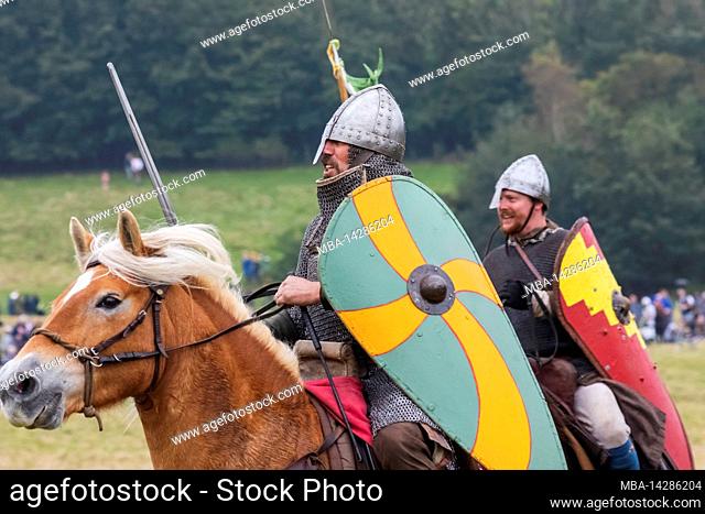 England, East Sussex, Battle, The Annual Battle of Hastings 1066 Re-enactment Festival, Participants Dressed in Medieval Norman Armour Charging on Horseback