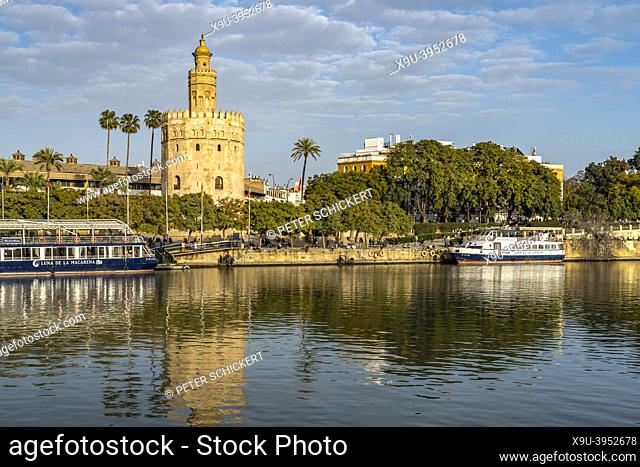 Guadalquivir river bank and the historic watchtower Torre del Oro in Seville, Andalusia, Spain