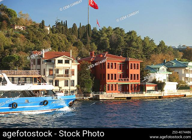 View of the Abdulgaffar Yalisi in Vanikoy village, a neighbourhoods on the Asian side of the Bosphorus in Uskudar district with a traditional ferry at the pier...