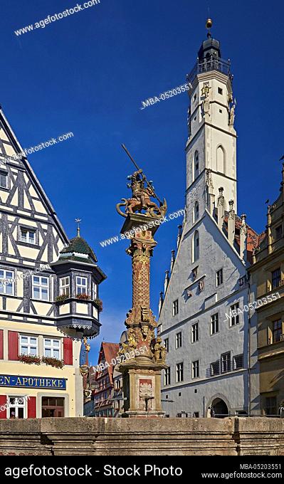 Herterichsbrunnen and town hall tower in Rothenburg ob der Tauber, Middle Franconia, Bavaria, Germany