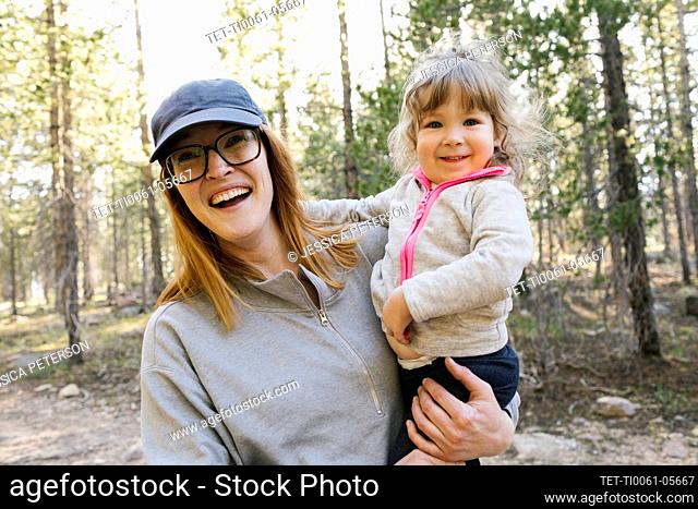 Portrait of happy mother with little daughter (2-3) in Uinta-Wasatch-Cache National Forest