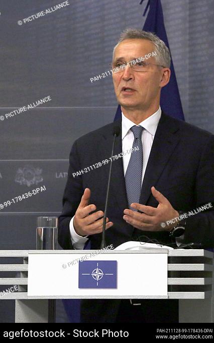 28 November 2021, Latvia, Riga: NATO Secretary General Jens Stoltenberg speaks at a press conference in connection with his visit with EU Commission President...