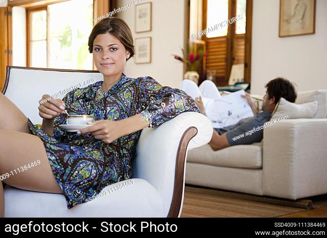 Hispanic couple relaxing in living room