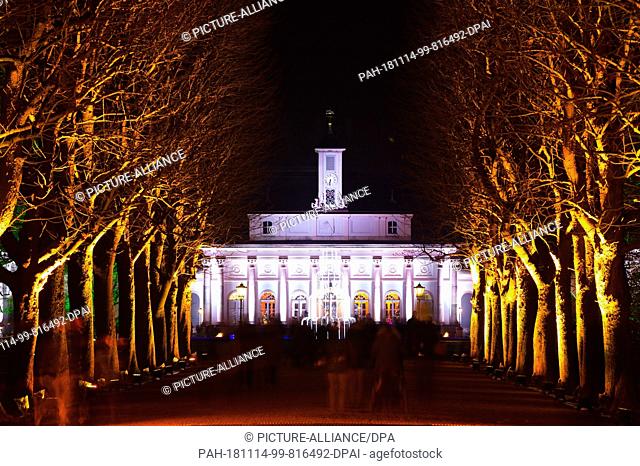 14 November 2018, Saxony, Dresden: The Bergpalais in Dresden's Pillnitz Palace and Park is brightly lit. The lighting is part of the light spectacle ""Christmas...