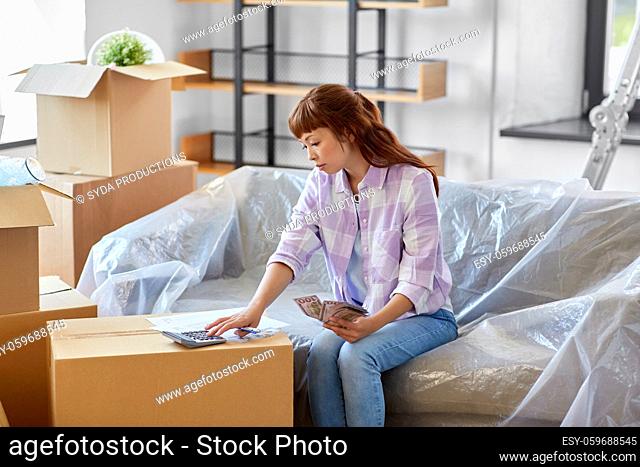 asian woman moving to new home and counting money