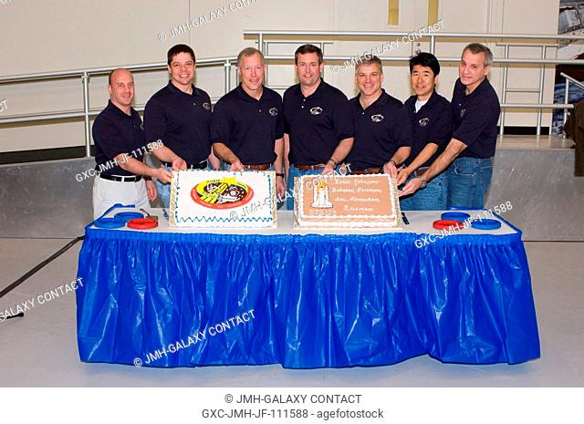 The STS-123 crewmembers celebrate the end of formal crew training with a cake-cutting ceremony in the Jake Garn Simulation and Training Facility at Johnson...