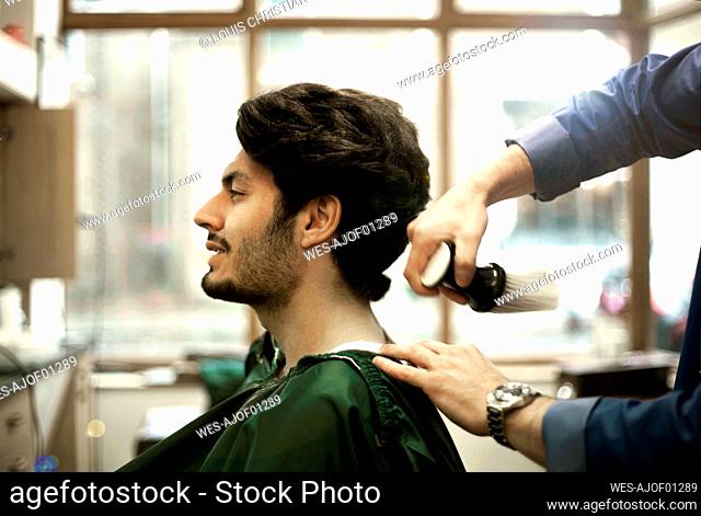 Head of male customer sitting in Barber Shop