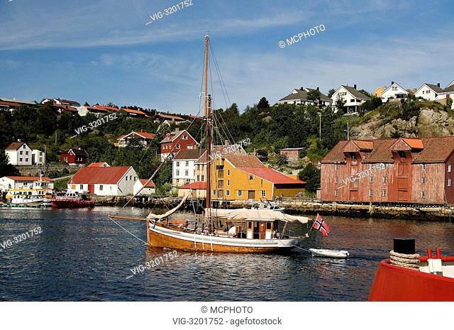 The old fishing boat (now working as a private touring ship) Tvende Brödre (meaning Two Brothers) of Farsund, Norway, entering Kristiansund Harbour in the...
