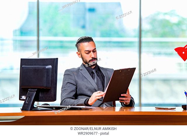 Sad businessman sitting in the office