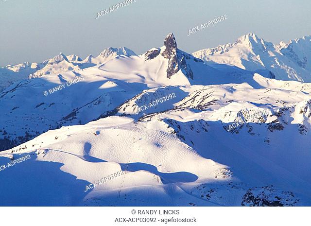 harmony express chairlift, harmony bowl with black tusk and tantalus range in background, british columbia, Canada