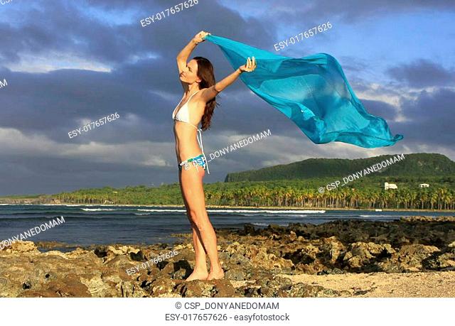 Young woman in bikini standing at Las Galeras beach, Samana peninsula, Dominican Republic