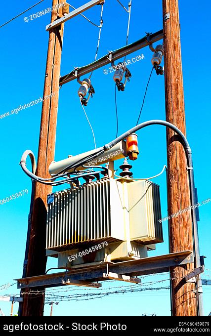 wood pylon energy and current line  in oman the electric cable