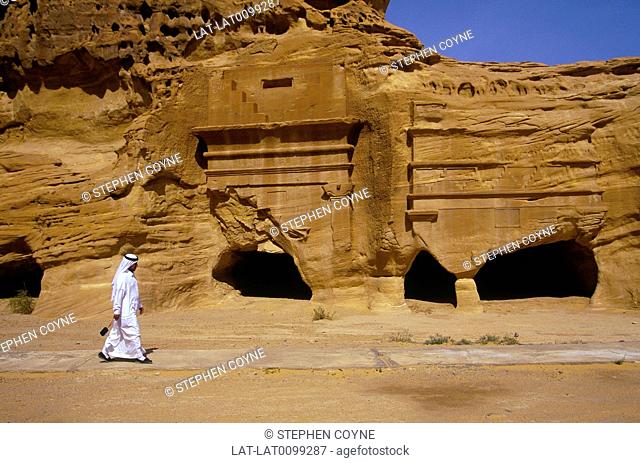 Nabatean archaeological site. Al-Khuraymat tomb, carved portal in sandstone rock. Caves. Man