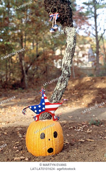 Traditional Halloween decorations include hollowing out a large pumpkin fruit or gourd, and lighting a candle inside the yellow orange skin