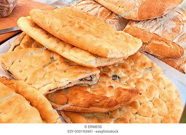 Italian food: traditional focaccia (schiacciata of Tuscany), a flat oven-baked bread product with olive oil, very popular in Italy