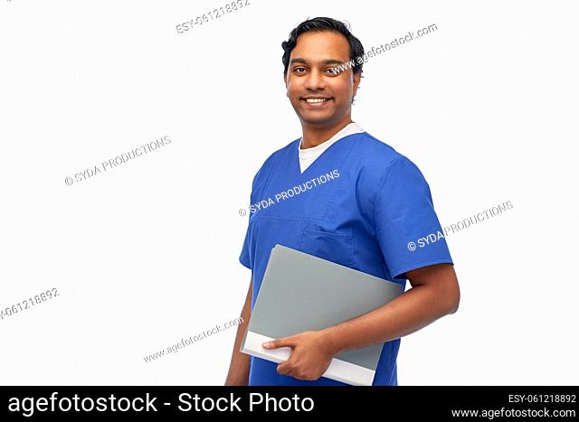 happy indian doctor or male nurse with folder