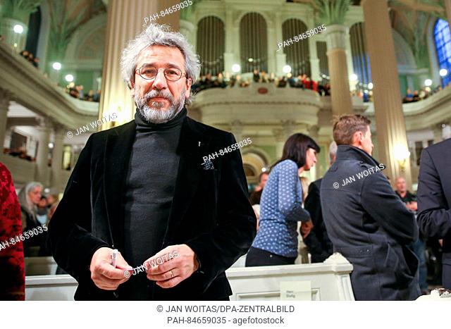 Turkish journalist Can Dundar stands before the prayer for peace in St. Nicholas' Church in Leipzig, Germany, 09 October 2016