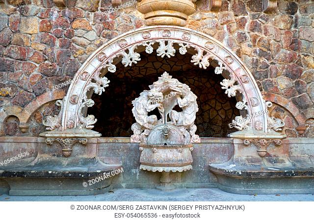The fountain statues of the dragons at the portal of the Guardians - the entrance way to the Initiatic well in Quinta da Regaleira estate. Sintra