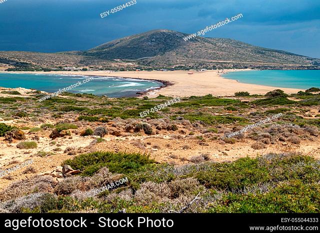 Scenic view from peninsula Prasonisi on Rhodes island, Greece with the aegean see on the right and the mediterranean see on the left side with dark sky before a...