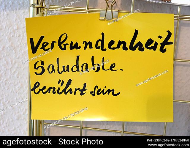 24 March 2023, Saxony, Leipzig: In the ""Grand Beauty"" salon in Robert Koch Park in Leipzig's west, various boards and slips of paper with sayings and remarks...